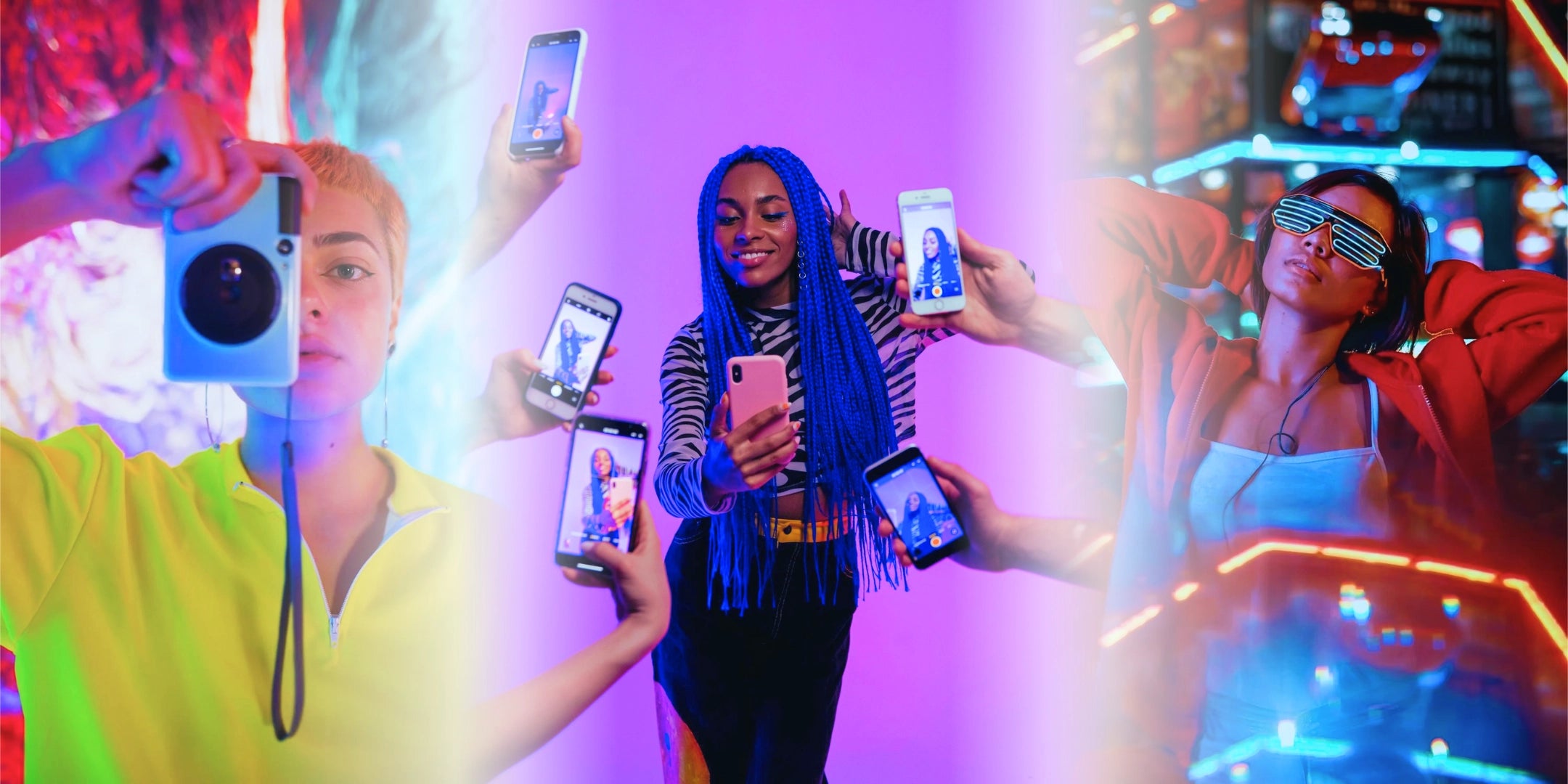 People capturing the moment in a vibrant, colorful setting with neon lights.