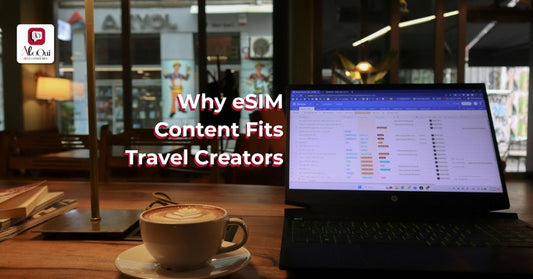 Laptop and coffee on a cafe table with the words Why eSIM Content Fits Travel Creators - AloOui eSIM