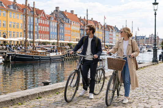 Illustration of travellers stopped beside bicycles on a Copenhagen waterfront for an eSIM guide - AloOui eSIM