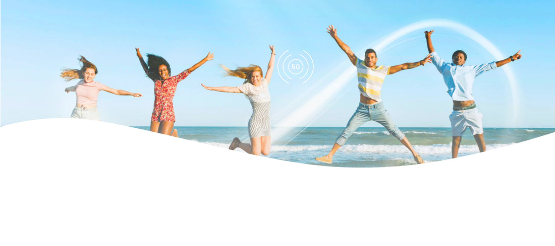 People playing in water with 5G connection of AloOui eSIM on a beach